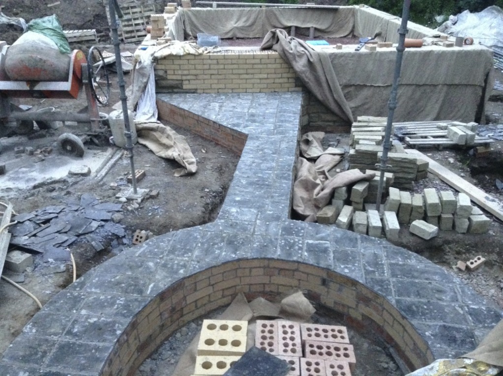 DPC on the curved boot room wall and the wall for the outdoor covered area and fireplace