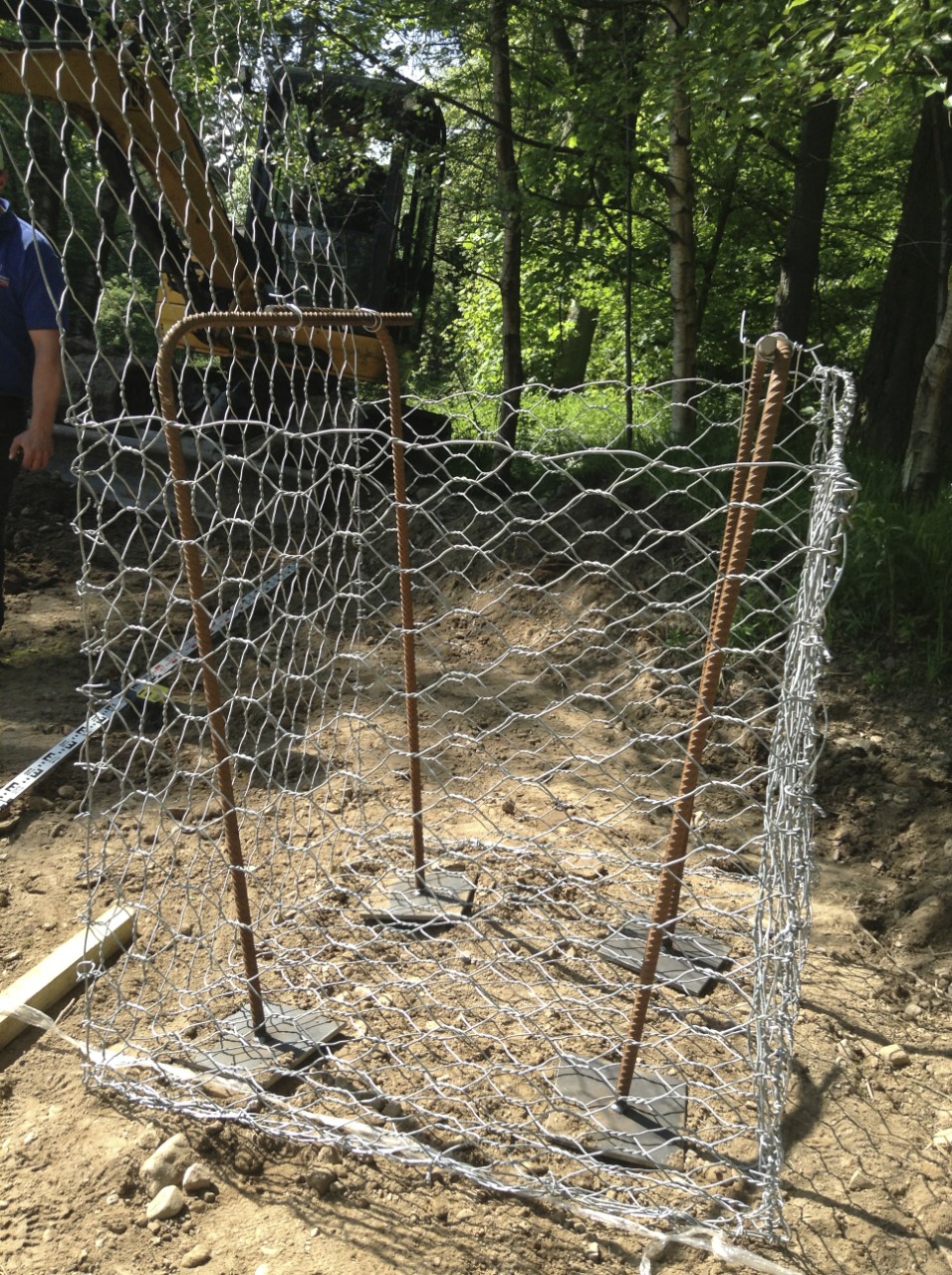 Wire cage to be sunk in the ground and filled with aggregate.